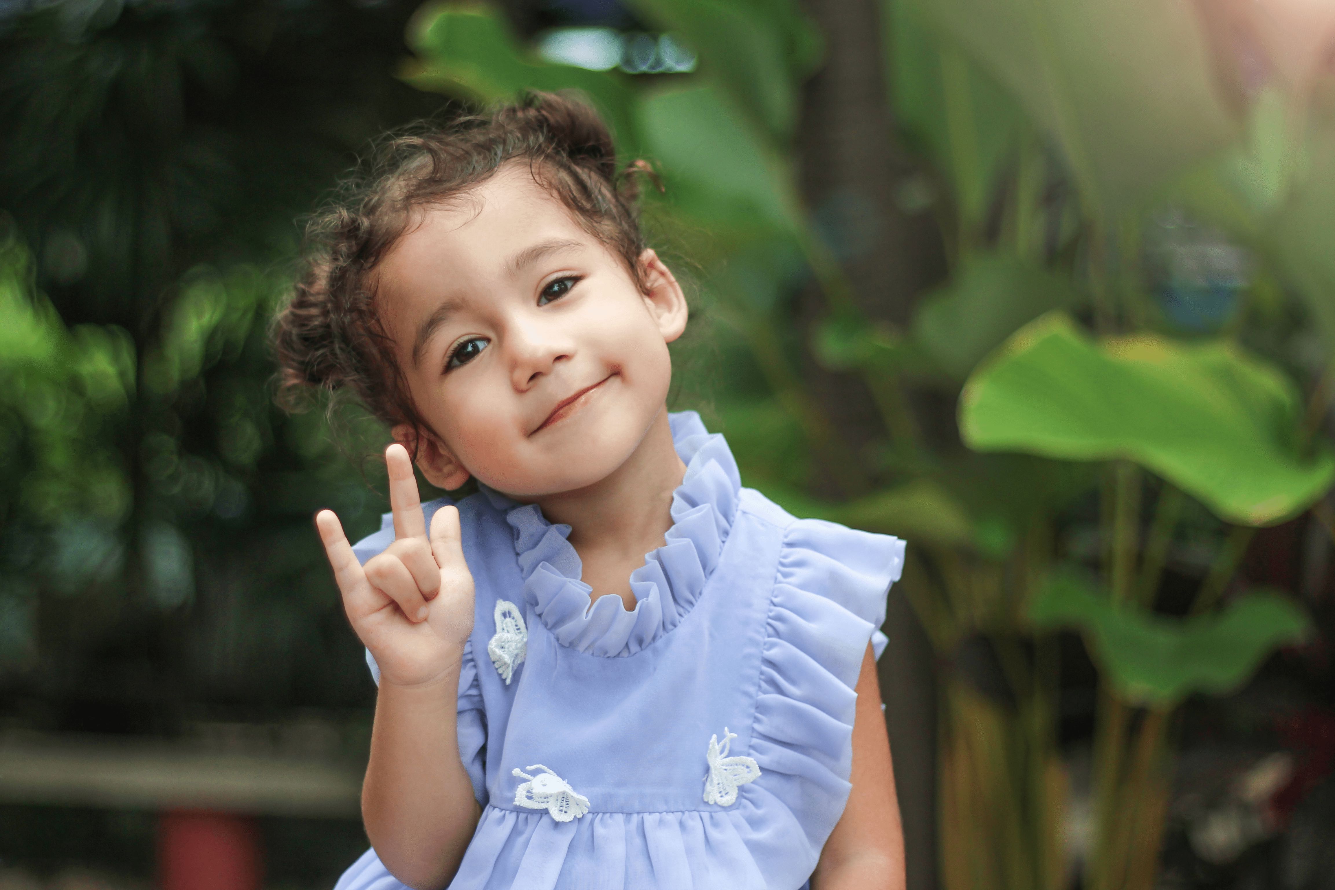 Little child using sign language